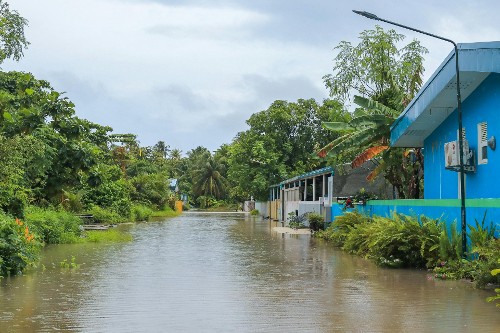 Image shows a flooded village in the Maldives, a SIDS and the smallest country in Asia.